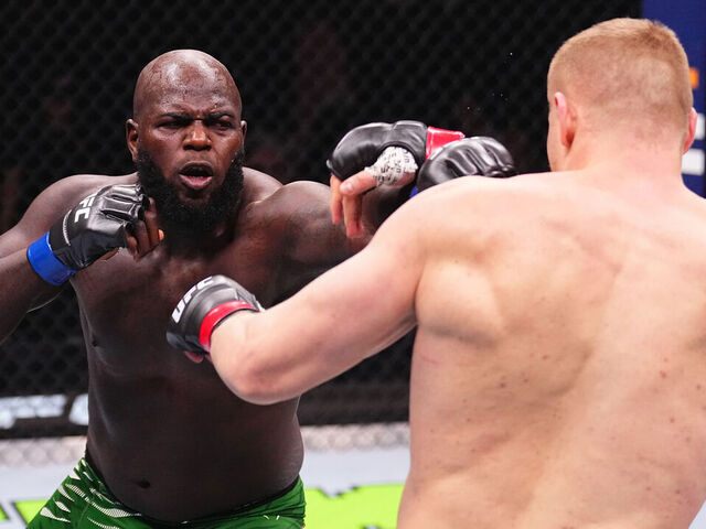 RIYADH, SAUDI ARABIA - FEBRUARY 01: (L-R) Jairzinho Rozenstruik of Suriname punches Sergei Pavlovich of Russia in a heavyweight fight during the UFC Fight Night event at anb Arena on February 01, 2025 in Riyadh, Saudi Arabia.