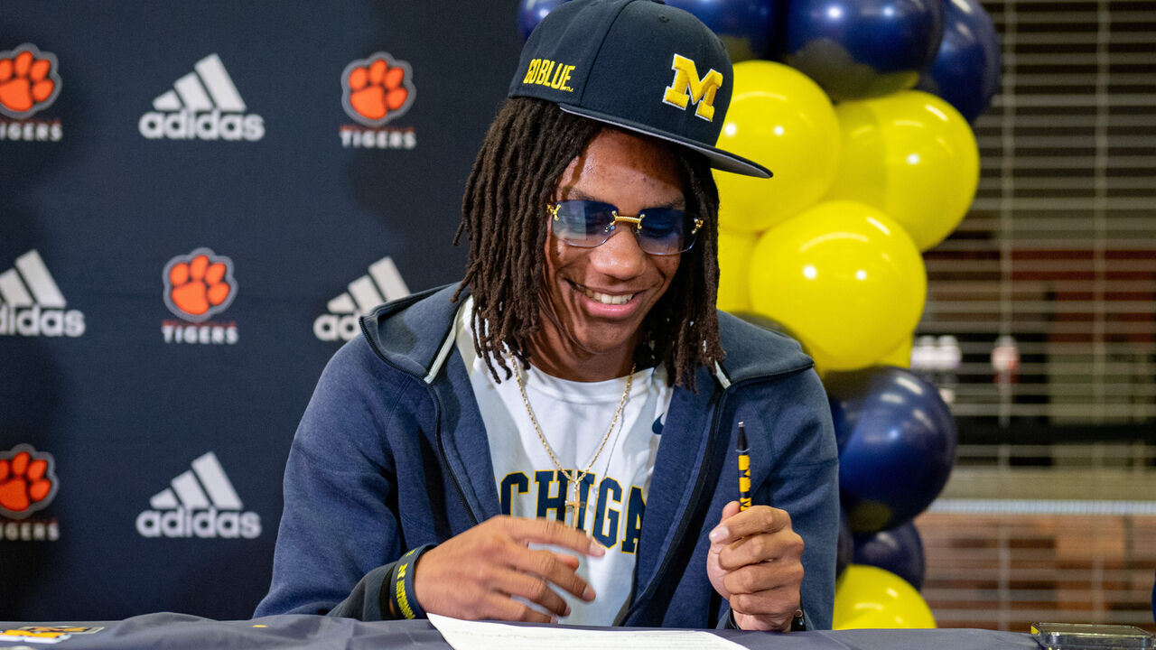 BELLEVILLE, MICHIGAN - DECEMBER 04: Four-star high school safety recruit Elijah Dotson signs his letter of intent to play for the Michigan Wolverines at Belleville High School on December 04, 2024 in Belleville, Michigan.