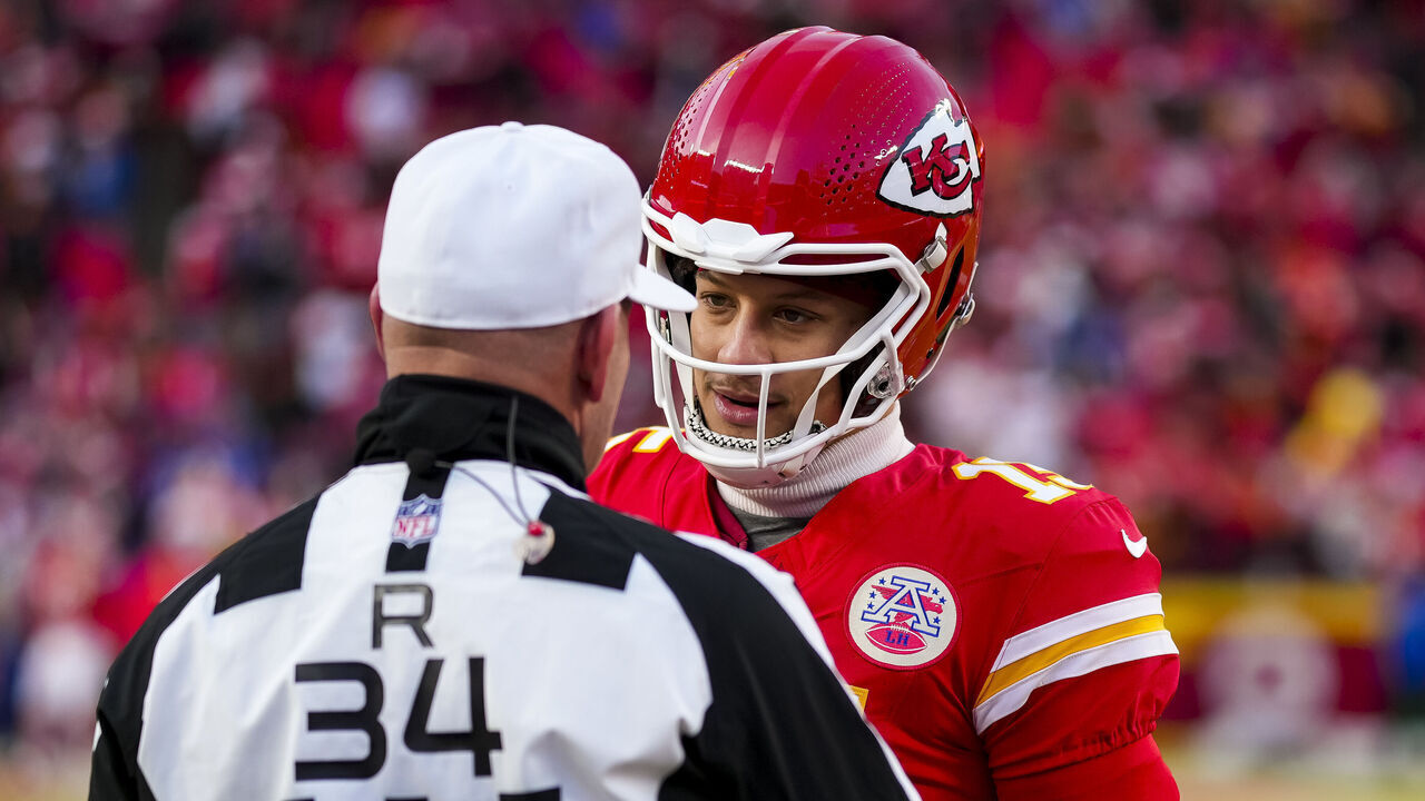 KANSAS CITY, MISSOURI - JANUARY 26: Quarterback Patrick Mahomes #15 of the Kansas City Chiefs interacts with referee Clete Blakeman #34 prior to the AFC Championship game against the Buffalo Bills, at GEHA Field at Arrowhead Stadium on January 26, 2025 in Kansas City, Missouri.