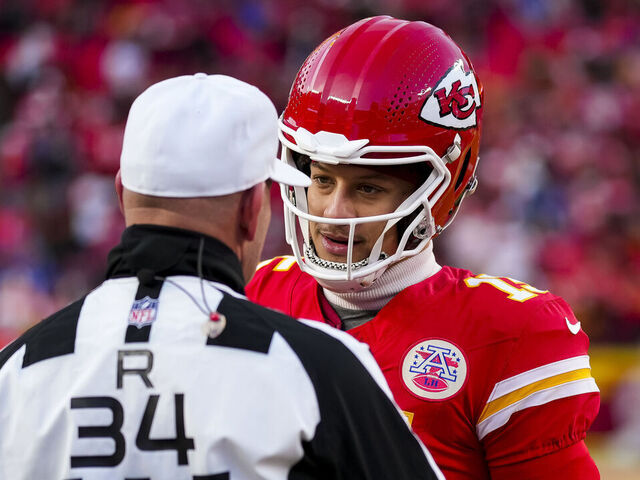 KANSAS CITY, MISSOURI - JANUARY 26: Quarterback Patrick Mahomes #15 of the Kansas City Chiefs interacts with referee Clete Blakeman #34 prior to the AFC Championship game against the Buffalo Bills, at GEHA Field at Arrowhead Stadium on January 26, 2025 in Kansas City, Missouri.