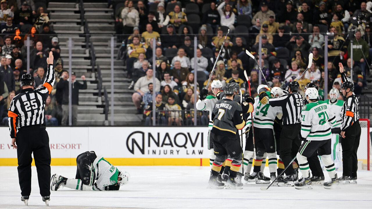 LAS VEGAS, NEVADA - JANUARY 28: Miro Heiskanen #4 of the Dallas Stars reacts after being injured on a hit from Mark Stone #61 of the Vegas Golden Knights as the teams scuffle behind him in the third period of their game at T-Mobile Arena on January 28, 2025 in Las Vegas, Nevada. Stone, who said he was tripped into Heiskanen, received a two-minute minor penalty for tripping on the play. The Stars defeated the Golden Knights 4-3 in overtime.