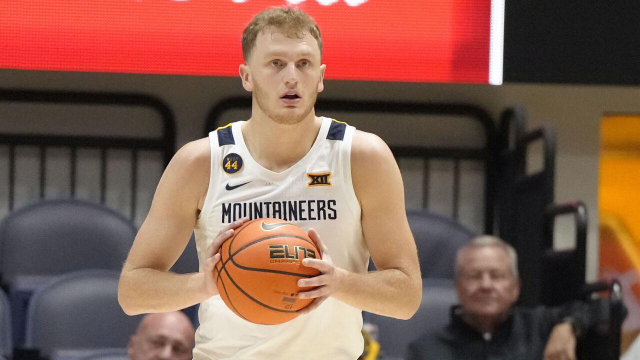 MORGANTOWN, WV- OCTOBER 18: Tucker DeVries #12 of the West Virginia Mountaineers dribbles up court during an exhibition college basketball game against the Charleston Golden Eagles at WVU Coliseum on October 18, 2024 in Morgantown, West Virginia.