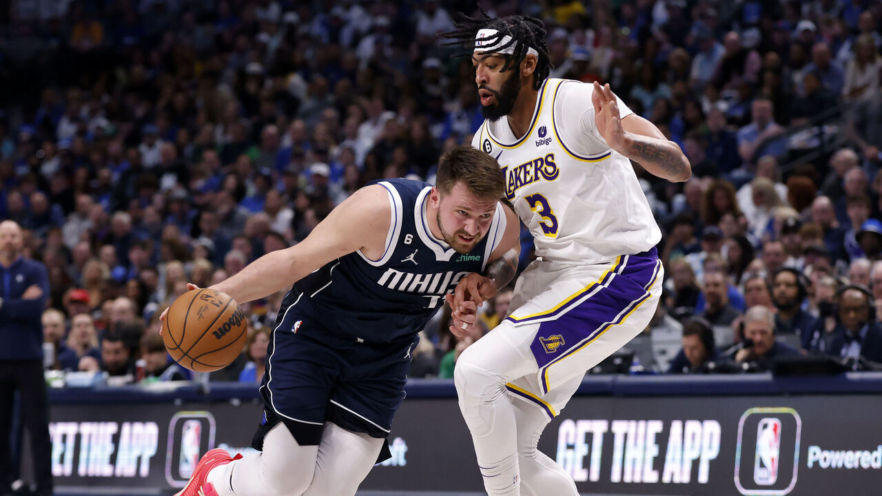 DALLAS, TX - FEBRUARY 26: Luka Doncic #77 of the Dallas Mavericks handles the ball against Anthony Davis #3 of the Los Angeles Lakers in the first half of the game at American Airlines Center on February 26, 2023 in Dallas, Texas.