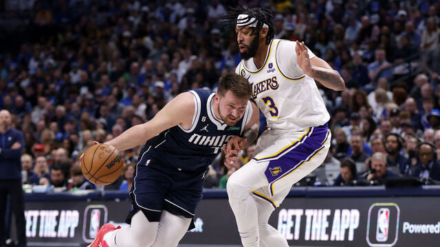 DALLAS, TX - FEBRUARY 26: Luka Doncic #77 of the Dallas Mavericks handles the ball against Anthony Davis #3 of the Los Angeles Lakers in the first half of the game at American Airlines Center on February 26, 2023 in Dallas, Texas.
