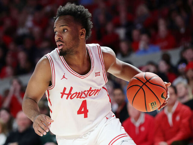 HOUSTON, TEXAS - JANUARY 06: L.J. Cryer #4 of the Houston Cougars handles the ball against the TCU Horned Frogs during the first half at Fertitta Center on January 06, 2025 in Houston, Texas.