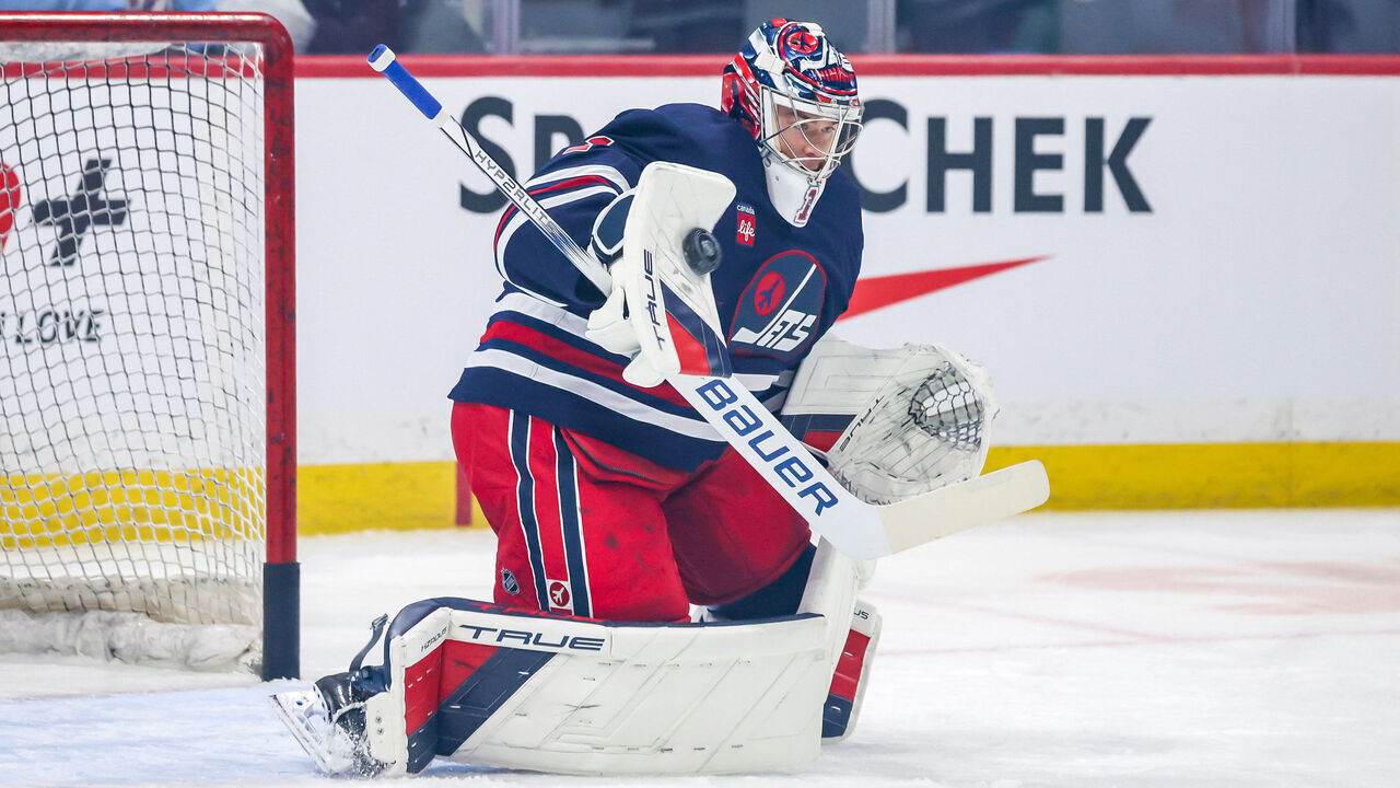 WINNIPEG, CANADA - FEBRUARY 4: Goaltender Eric Comrie #1 of the Winnipeg Jets takes part in the pre-game warm up prior to NHL action against the Carolina Hurricanes at the Canada Life Centre on February 4, 2025 in Winnipeg, Manitoba, Canada.