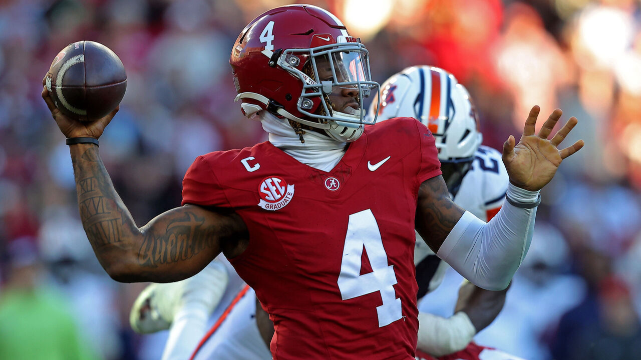 TUSCALOOSA, ALABAMA - NOVEMBER 30: Jalen Milroe #4 of the Alabama Crimson Tide attempts a pass during the first half against the Auburn Tigers at Bryant-Denny Stadium on November 30, 2024 in Tuscaloosa, Alabama.