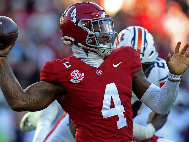 TUSCALOOSA, ALABAMA - NOVEMBER 30: Jalen Milroe #4 of the Alabama Crimson Tide attempts a pass during the first half against the Auburn Tigers at Bryant-Denny Stadium on November 30, 2024 in Tuscaloosa, Alabama.