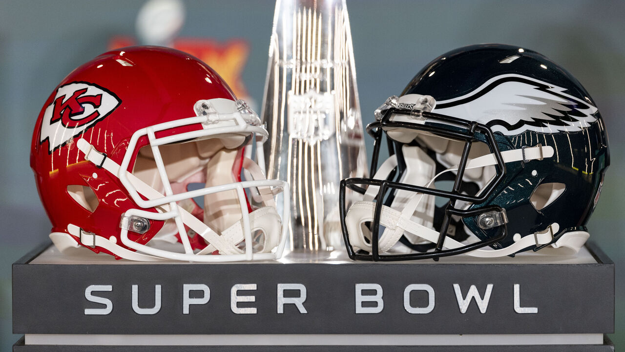 NEW ORLEANS, LOUISIANA - FEBRUARY 03: A detail shot of the Lombardi Trophy next to Kansas City Chiefs and Philadelphia Eagles helmets prior to a news conference on February 03, 2025 in New Orleans, Louisiana ahead of the NFL Super Bowl LIX football game between the Philadelphia Eagles and the Kansas City Chiefs.