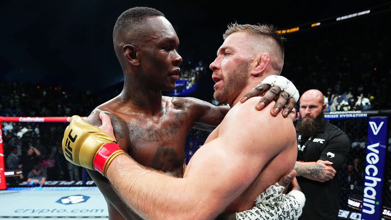 PERTH, AUSTRALIA - AUGUST 18: (R-L) Dricus Du Plessis of South Africa and Israel Adesanya of Nigeria talk after their UFC middleweight championship fight during the UFC 305 event at RAC Arena on August 18, 2024 in Perth, Australia.