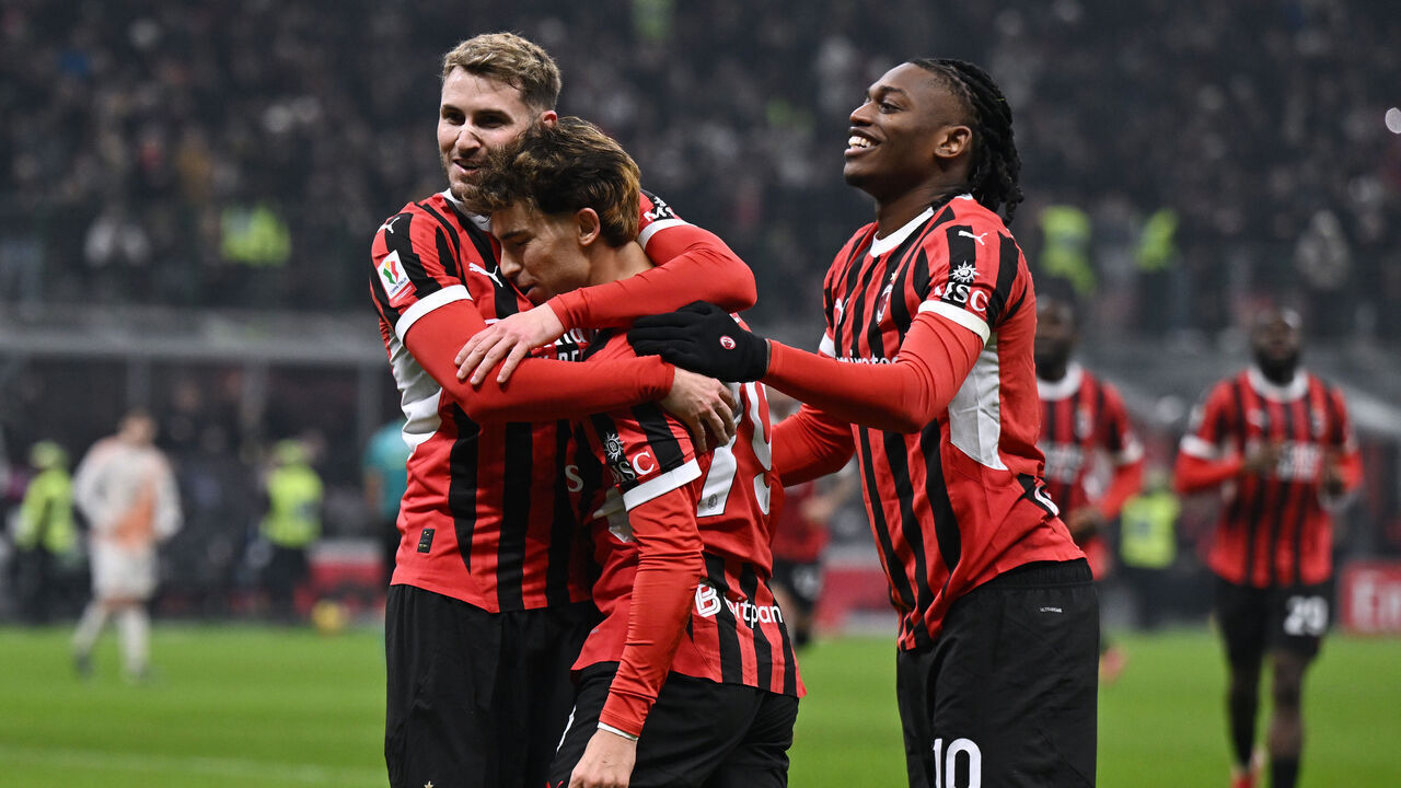 MILAN, ITALY - FEBRUARY 05: Joao Felix of Milan celebrates his goal with Santiago Gimenez and Rafael Leao of Milan during the Coppa Italia match between AC Milan and AS Roma at Stadio Giuseppe Meazza on February 05, 2025 in Milan, Italy.