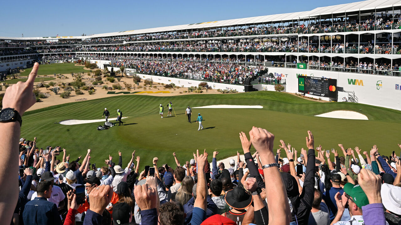 SCOTTSDALE, ARIZONA - FEBRUARY 10: Rickie Fowler reacts to the crowd after making a putt on the 16th green during the second round of the WM Phoenix Open at TPC Scottsdale on February 10, 2023 in Scottsdale, Arizona.