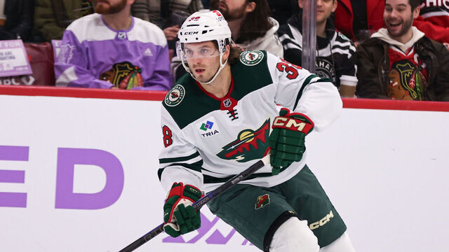 CHICAGO, IL - JANUARY 26: Ryan Hartman #38 of the Minnesota Wild controls the puck during the first period against the Chicago Blackhawks on January 26, 2025 at the United Center in Chicago, Illinois.