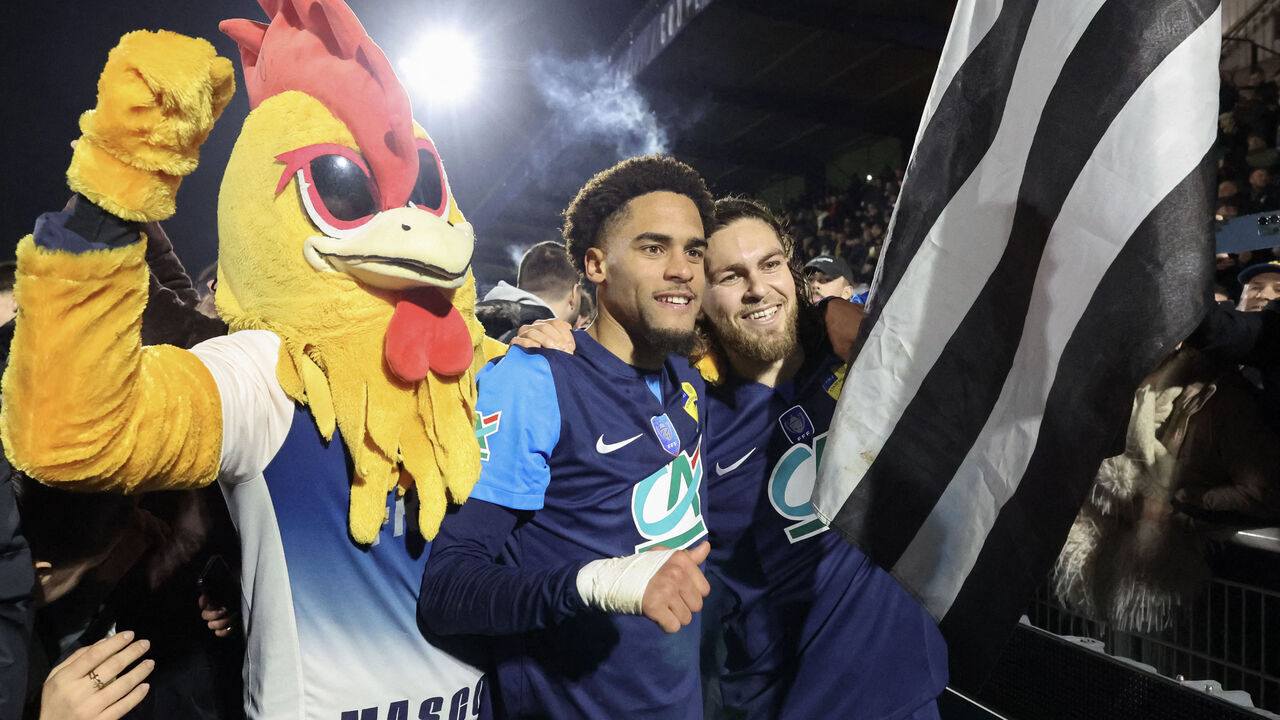 Stade Briochin's French forward #09 Aimeric Gomis-Maillard (L) celebrates with his teammate Stade Briochin's French midfielder #06 Leo Yobe after winning the French Cup (Coupe de France) round of 16 football match between Stade Briochin (Saint-Brieuc) and OGC Nice at the Stade Fred-Aubert stadium in Saint-Brieuc, the western France, on February 5, 2025.