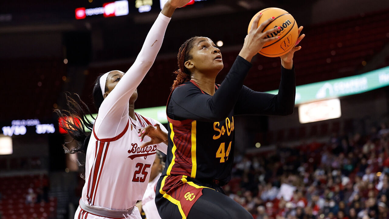 MADISON, WISCONSIN - FEBRUARY 05: Kiki Iriafen #44 of the USC Trojans scores past Serah Williams #25 of the Wisconsin Badgers during the first half of the game at Kohl Center on February 05, 2025 in Madison, Wisconsin.