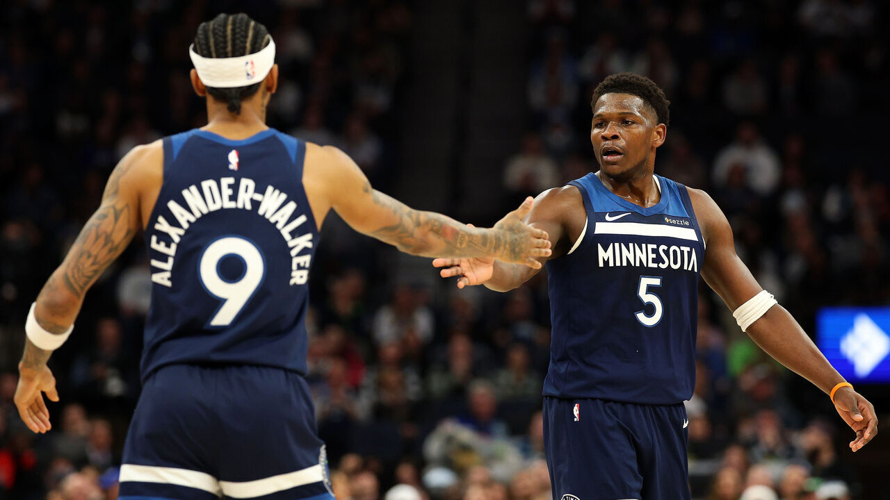 MINNEAPOLIS, MINNESOTA - FEBRUARY 05: Anthony Edwards #5 of the Minnesota Timberwolves celebrates with Nickeil Alexander-Walker #9 in the first quarter against the Chicago Bulls at Target Center on February 05, 2025 in Minneapolis, Minnesota.