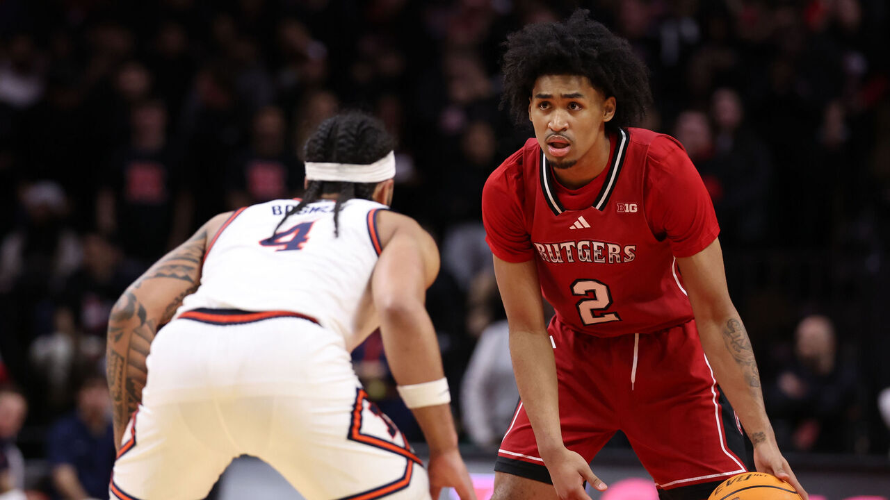 PISCATAWAY, NEW JERSEY - FEBRUARY 5: Dylan Harper #2 of the Rutgers Scarlet Knights handles the ball while being defended by Kylan Boswell #4 of the Illinois Fighting Illini during the second half at Jersey Mike's Arena on February 5, 2025 in Piscataway, New Jersey.