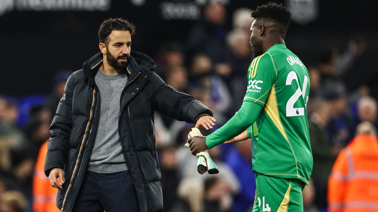 Manchester United's Portuguese head coach Ruben Amorim (L) shakes hands with Manchester United's Cameroonian goalkeeper #24 Andre Onana (R) at the end of the English Premier League football match between Ipswich Town and Manchester United at Portman Road in Ipswich, eastern England on November 24, 2024. Ipswich Town and Manchester United equalised 1 - 1.