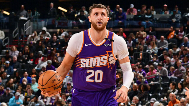PHOENIX, AZ - DECEMBER 27: Jusuf Nurkic #20 of the Phoenix Suns handles the ball during the game against the Dallas Mavericks on December 27, 2024 at Footprint Center in Phoenix, Arizona. Mandatory Copyright Notice: Copyright 2024 NBAE