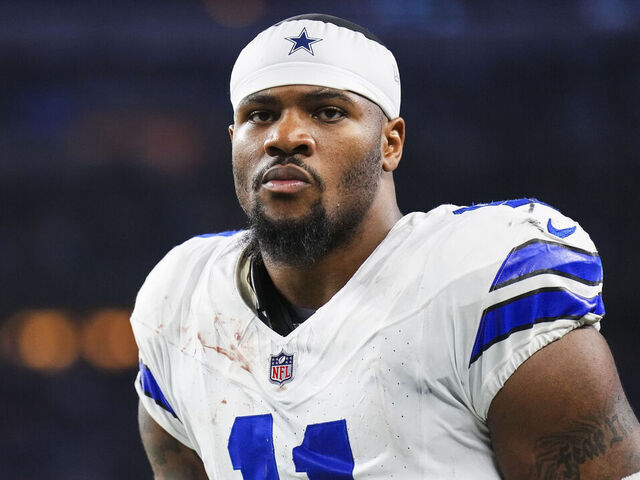 ARLINGTON, TX - DECEMBER 22: Micah Parsons #11 of the Dallas Cowboys looks on from the field during an NFL football game against the Tampa Bay Buccaneers at AT&T Stadium on December 22, 2024 in Arlington, Texas.
