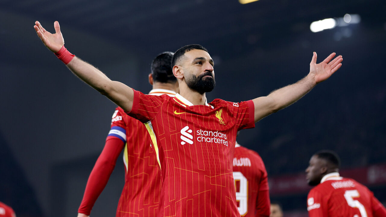 LIVERPOOL, ENGLAND - FEBRUARY 06: (THE SUN OUT, THE SUN ON SUNDAY OUT) Mohamed Salah of Liverpool celebrates scoring his team's second goal from the penalty-spot during the Carabao Cup Semi Final Second Leg match between Liverpool and Tottenham Hotspur at Anfield on February 06, 2025 in Liverpool, England.