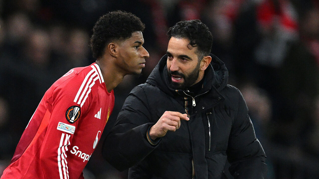 MANCHESTER, ENGLAND - NOVEMBER 28: Ruben Amorim, Head Coach of Manchester United, speaks to Marcus Rashford of Manchester United as he prepares to enter the pitch as a substitute during the UEFA Europa League 2024/25 League Phase MD5 match between Manchester United and FK Bodo/Glimt at Old Trafford on November 28, 2024 in Manchester, England.