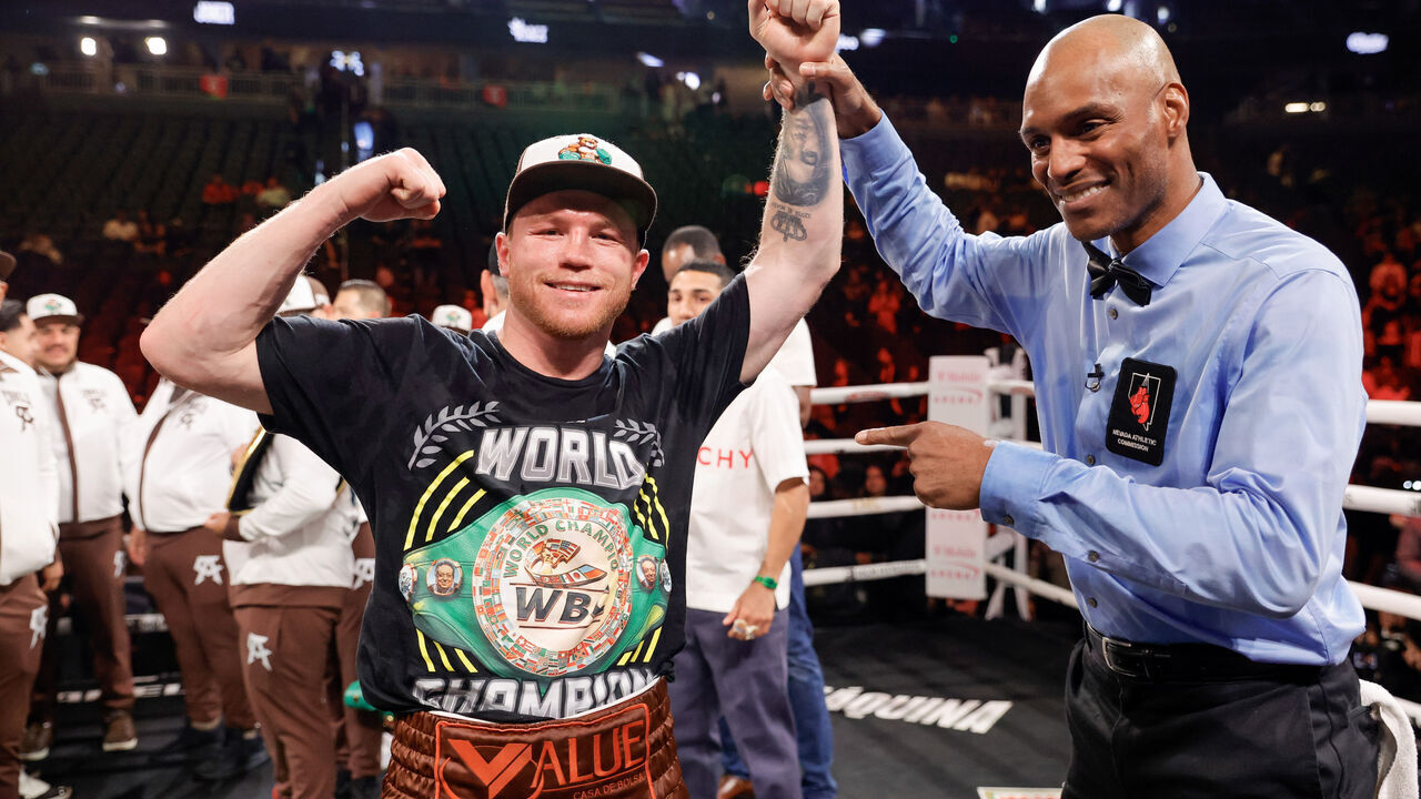 LAS VEGAS, NEVADA - SEPTEMBER 14: WBC/WBA/WBO super middleweight champion Canelo Alvarez poses for a photo with referee Harvey Dock after Alvarez's won a title fight by unanimous decision against Edgar Berlanga, not pictured, at T-Mobile Arena on September 14, 2024 in Las Vegas, Nevada.