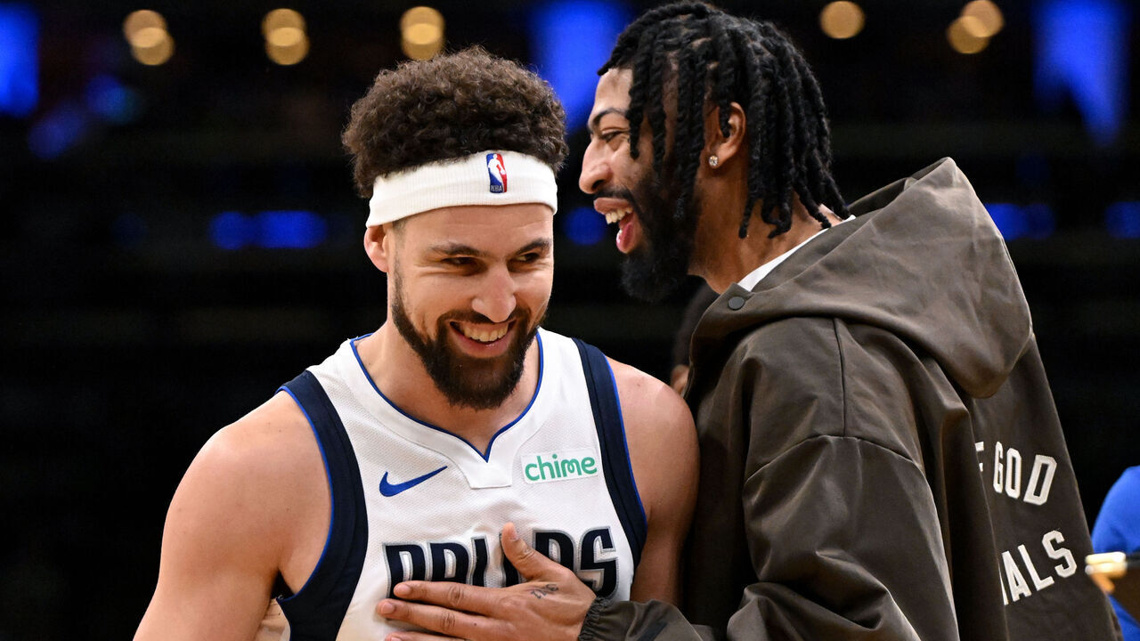 BOSTON, MASSACHUSETTS - FEBRUARY 06: Anthony Davis #3 and Klay Thompson #31 of the Dallas Mavericks laugh during a timeout in the second quarter against the Boston Celticsat the TD Garden on February 06, 2025 in Boston, Massachusetts.