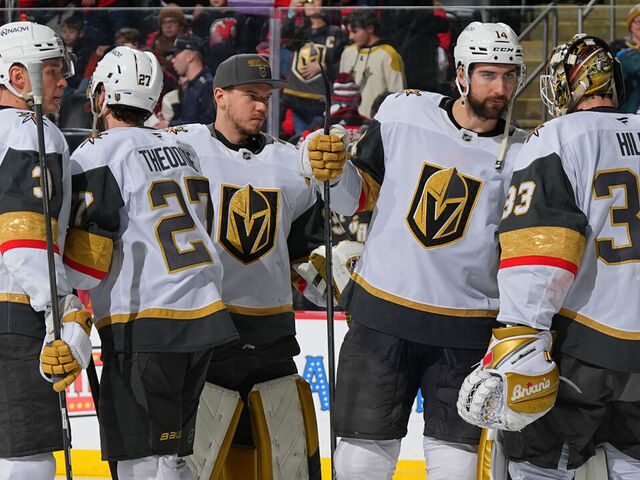 NEWARK, NJ - FEBRUARY 06: Adin Hill #33 of the Vegas Golden Knights celebrates with teammates the win in the game against the New Jersey Devils at Prudential Center on February 6, 2025 in Newark, New Jersey.