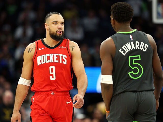 MINNEAPOLIS, MINNESOTA - FEBRUARY 06: Dillon Brooks #9 of the Houston Rockets interacts with Anthony Edwards #5 of the Minnesota Timberwolves in the second quarter at Target Center on February 06, 2025 in Minneapolis, Minnesota.