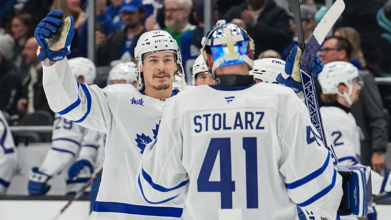 SEATTLE, WASHINGTON - FEBRUARY 06: John Tavares #91 celebrates with Anthony Stolarz #41 of the Toronto Maple Leafs after winning a game against the Seattle Kraken at Climate Pledge Arena on February 6, 2025 in Seattle, Washington.
