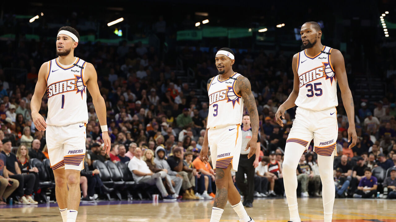 PHOENIX, ARIZONA - OCTOBER 28: (L-R) Devin Booker #1, Bradley Beal #3 and Kevin Durant #35 of the Phoenix Suns walk on the court during the first half of the NBA game against the Los Angeles Lakers at Footprint Center on October 28, 2024 in Phoenix, Arizona. The Suns defeated the Lakers 109-105. NOTE TO USER: User expressly acknowledges and agrees that, by downloading and/or using this photograph, user is consenting to the terms and conditions of the Getty Images License Agreement.