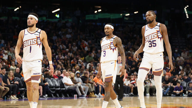 PHOENIX, ARIZONA - OCTOBER 28: (L-R) Devin Booker #1, Bradley Beal #3 and Kevin Durant #35 of the Phoenix Suns walk on the court during the first half of the NBA game against the Los Angeles Lakers at Footprint Center on October 28, 2024 in Phoenix, Arizona. The Suns defeated the Lakers 109-105. NOTE TO USER: User expressly acknowledges and agrees that, by downloading and/or using this photograph, user is consenting to the terms and conditions of the Getty Images License Agreement.