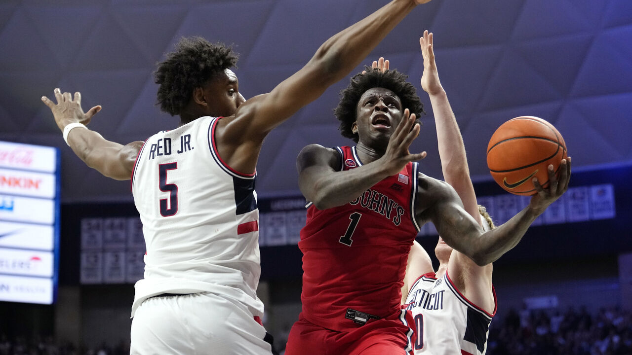 STORRS, CONNECTICUT - FEBRUARY 07: Kadary Richmond #1 of the St. John's Red Storm shoots against Tarris Reed Jr. #5 of the Connecticut Huskies during the second half of an NCAA basketball game at the Harry A. Gampel Pavilion on February 7, 2025 in Storrs, Connecticut. The Red Storm defeated the Huskies 68-62.