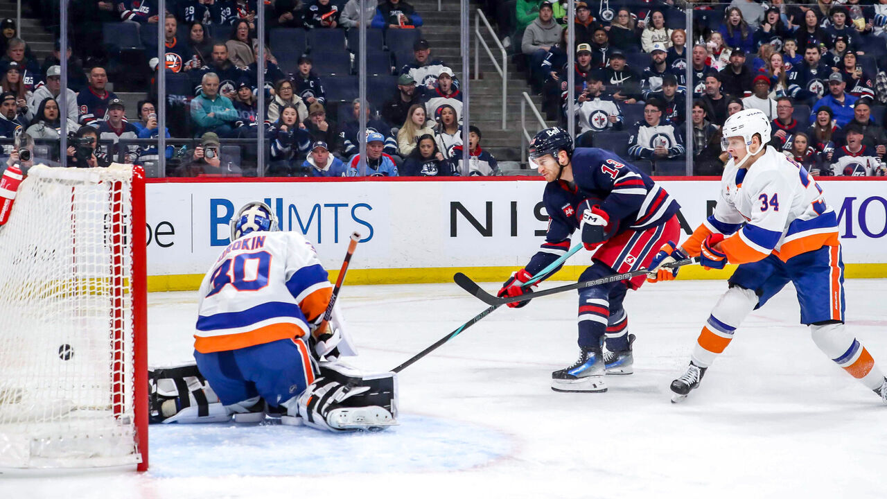 WINNIPEG, CANADA - FEBRUARY 7: Gabriel Vilardi #13 of the Winnipeg Jets redirects the puck past goaltender Ilya Sorokin #30 of the New York Islanders for a second period goal at the Canada Life Centre on February 7, 2025 in Winnipeg, Manitoba, Canada.