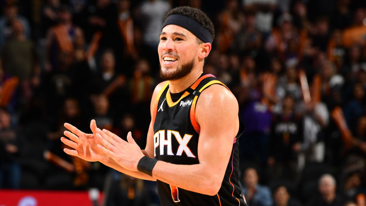 PHOENIX, AZ - FEBRUARY 7: Devin Booker #1 of the Phoenix Suns celebrates during the game against the Utah Jazz on February 7, 2025 at Footprint Center in Phoenix, Arizona. Mandatory Copyright Notice: Copyright 2025 NBAE