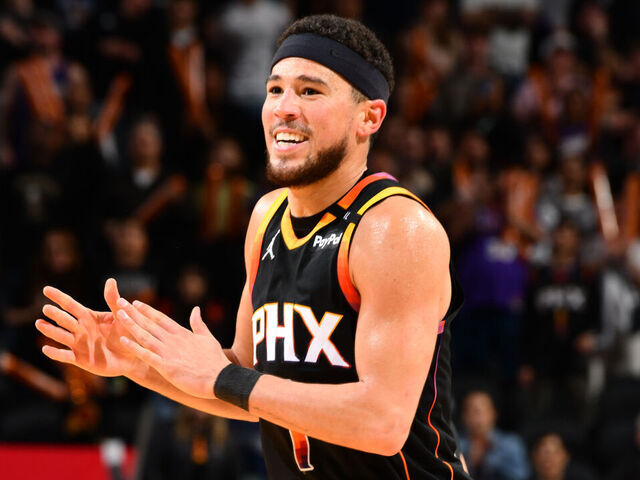 PHOENIX, AZ - FEBRUARY 7: Devin Booker #1 of the Phoenix Suns celebrates during the game against the Utah Jazz on February 7, 2025 at Footprint Center in Phoenix, Arizona. Mandatory Copyright Notice: Copyright 2025 NBAE