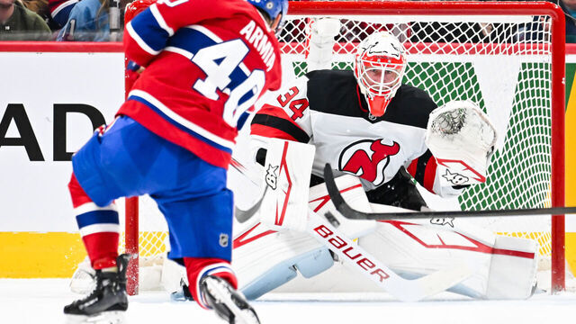 MONTREAL, CANADA - FEBRUARY 08: Joel Armia #40 of the Montreal Canadiens takes a shot towards goaltender Jake Allen #34 of the New Jersey Devils during the first period at the Bell Centre on February 8, 2025 in Montreal, Quebec, Canada.