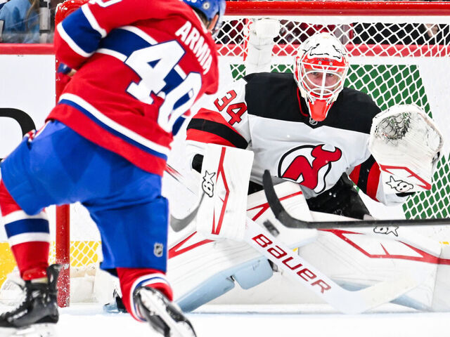 MONTREAL, CANADA - FEBRUARY 08: Joel Armia #40 of the Montreal Canadiens takes a shot towards goaltender Jake Allen #34 of the New Jersey Devils during the first period at the Bell Centre on February 8, 2025 in Montreal, Quebec, Canada.