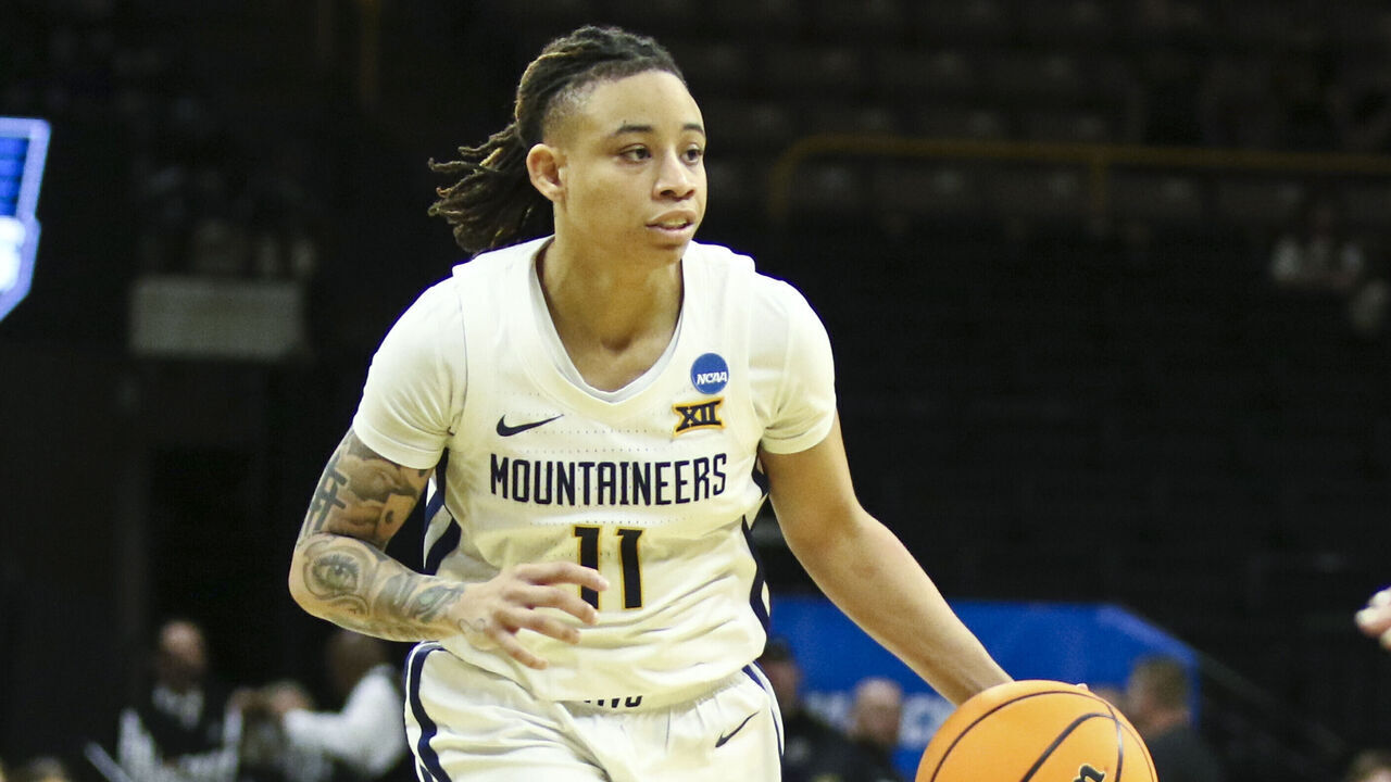 IOWA CITY, IOWA- MARCH 23: Guard JJ Quinerly #11 of the West Virginia Mountaineers goes down the court during the second half against the Princeton Tigers during their match-up in the 2024 NCAA Division 1 Womens Basketball Championship at Carver-Hawkeye Arena on March 23, 2024 in Iowa City, Iowa.