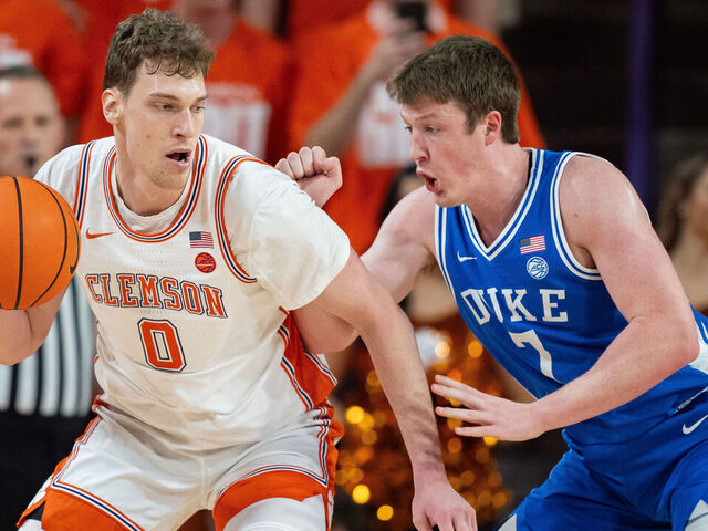CLEMSON, SOUTH CAROLINA - FEBRUARY 08: Kon Knueppel #7 of the Duke Blue Devils guards Viktor Lakhin #0 of the Clemson Tigers in the first half during their game at Littlejohn Coliseum on February 08, 2025 in Clemson, South Carolina.