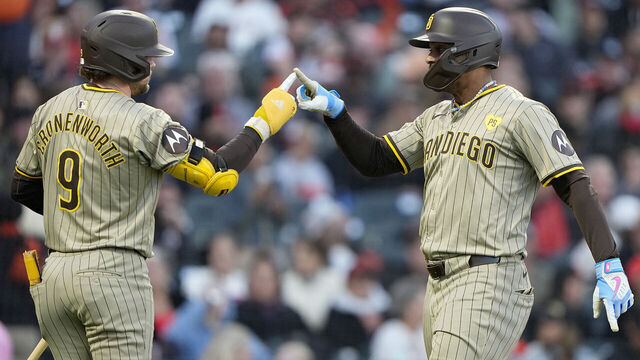 SAN FRANCISCO, CALIFORNIA - SEPTEMBER 14: Xander Bogaerts #2 and Jake Cronenworth #9 of the San Diego Padres celebrates after Bogaerts hit a solo home run against the San Francisco Giants in the top of the fourth inning at Oracle Park on September 14, 2024 in San Francisco, California.