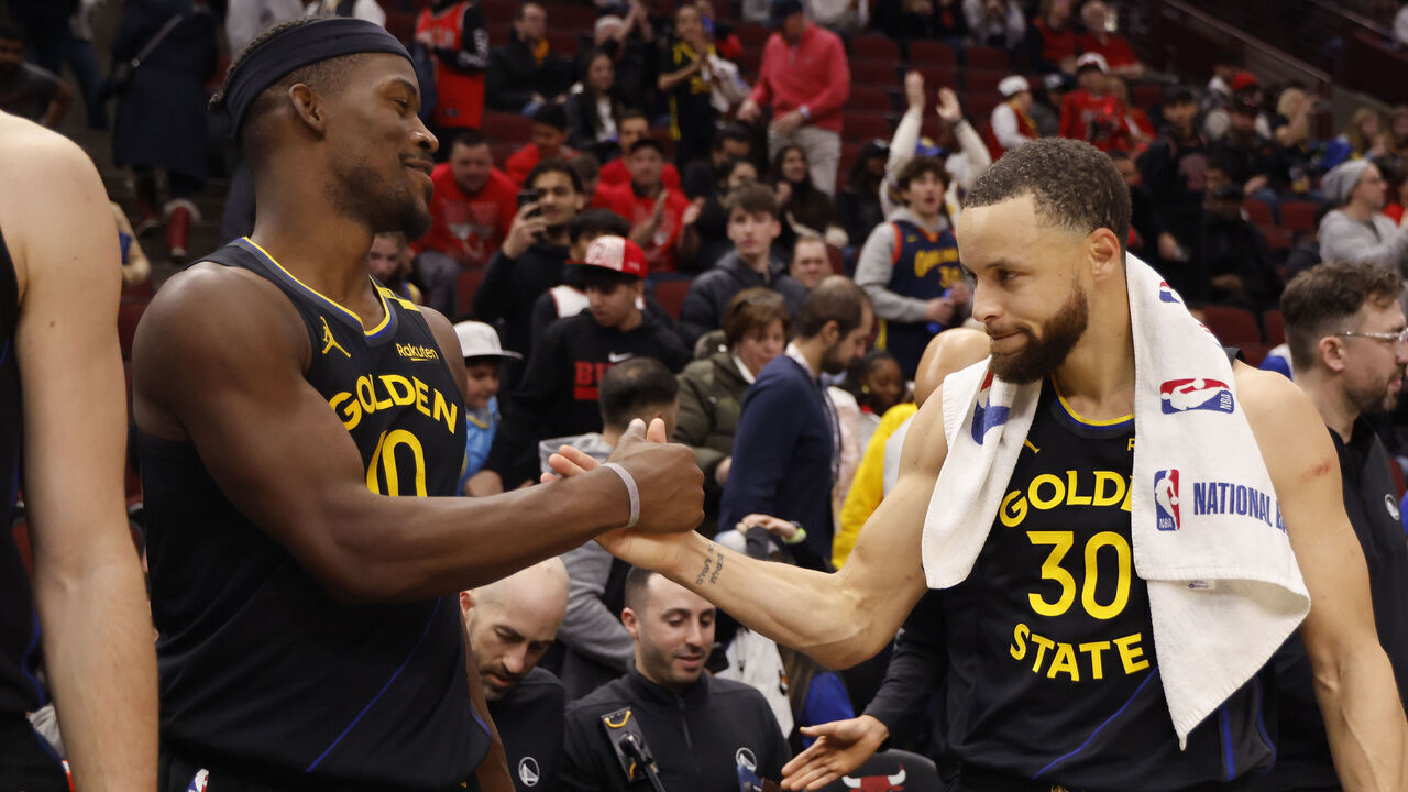 CHICAGO, ILLINOIS - FEBRUARY 08: Jimmy Butler #10 and Stephen Curry #30 of the Golden State Warriors celebrate after the game against the Chicago Bulls at the United Center on February 08, 2025 in Chicago, Illinois.