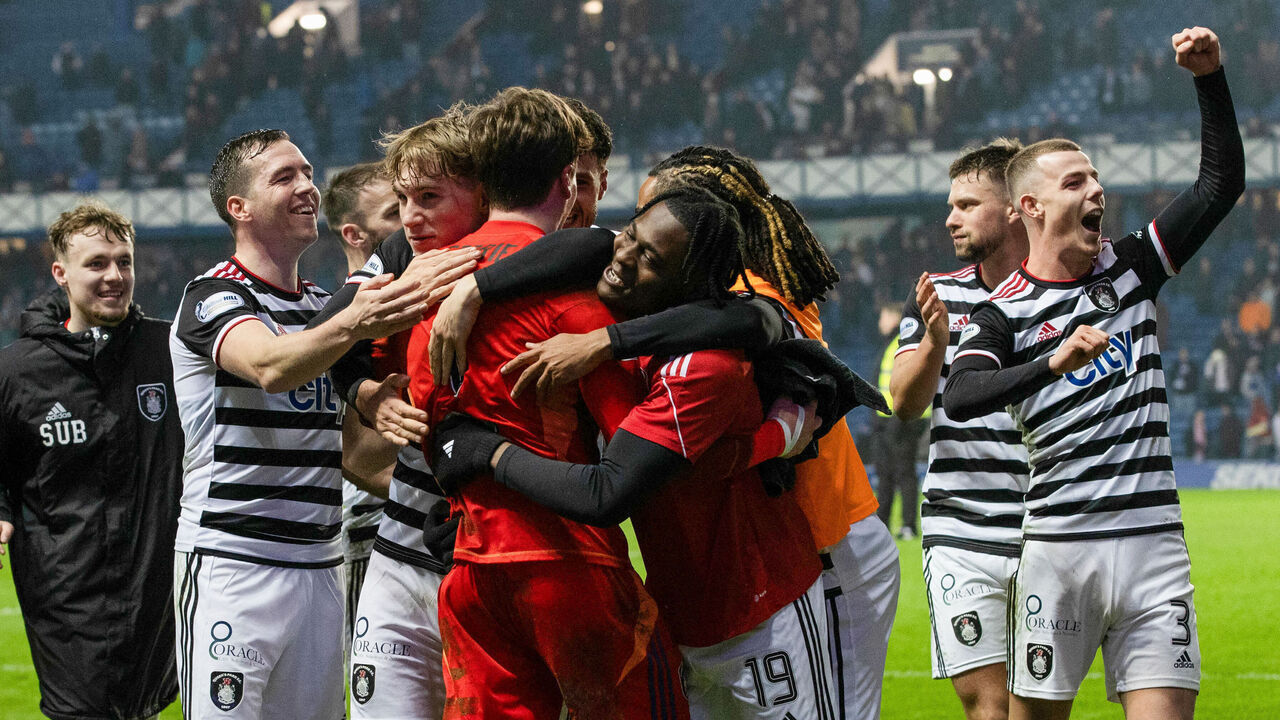 GLASGOW, SCOTLAND - FEBRUARY 09: Queen;s Park players celebrate with Calum Ferrie at full time during a Scottish Gas Men's Scottish Cup match between Rangers and Queen's Park at Ibrox Stadium, on February 09, 2025, in Glasgow, Scotland.