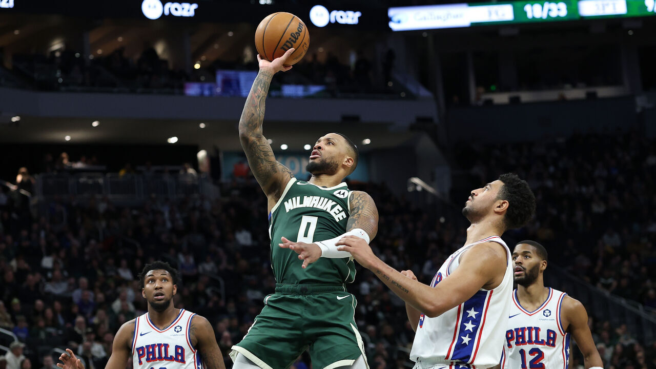 MILWAUKEE, WISCONSIN - FEBRUARY 09: Damian Lillard #0 of the Milwaukee Bucks drives to the basket during the first half of a game against the Philadelphia 76ers at Fiserv Forum on February 09, 2025 in Milwaukee, Wisconsin.