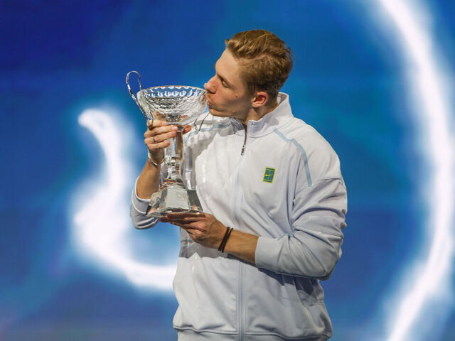 FRISCO, TX - FEBRUARY 09: Denis Shapovalov (CAN) kisses the trophy after winning the Dallas Open on February 9, 2025 at Ford Center at The Star in Frisco, TX.