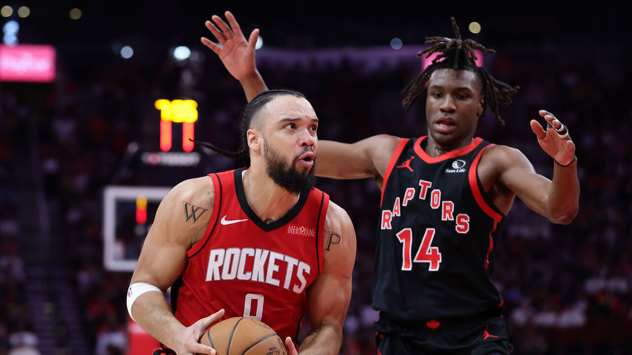 HOUSTON, TEXAS - FEBRUARY 09: Dillon Brooks #9 of the Houston Rockets handles the ball against Ja'Kobe Walter #14 of the Toronto Raptors during the first half at Toyota Center on February 09, 2025 in Houston, Texas.