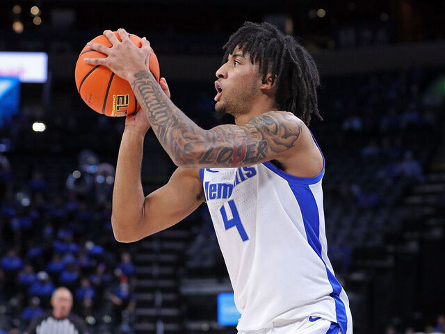 MEMPHIS, TENNESSEE - FEBRUARY 09: PJ Haggerty #4 of the Memphis Tigers takes a shot during the first half against the Temple Owls at FedExForum on February 09, 2025 in Memphis, Tennessee.
