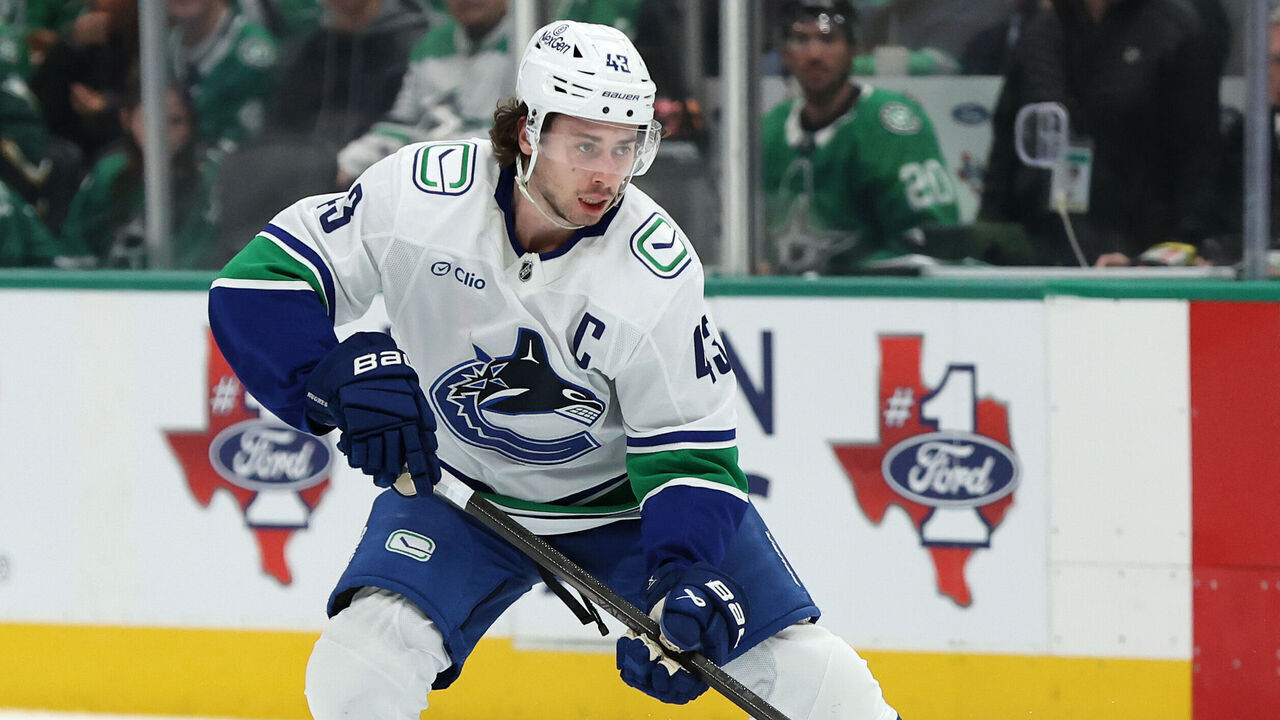 DALLAS, TEXAS - JANUARY 31: Quinn Hughes #43 of the Vancouver Canucks controls the puck during the second period against the Dallas Stars at American Airlines Center on January 31, 2025 in Dallas, Texas.