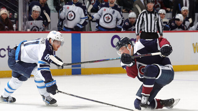 DENVER, COLORADO - JANUARY 22: Cale Makar #8 of the Colorado Avalanche shoots while Kyle Connor #81 of the Winnipeg Jets defends at Ball Arena on January 22, 2025 in Denver, Colorado.